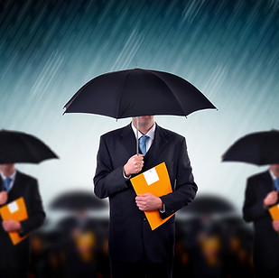 Businessmen with Umbrellas