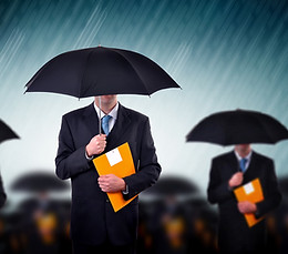 Businessmen with Umbrellas
