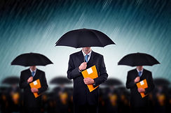 Businessmen with Umbrellas