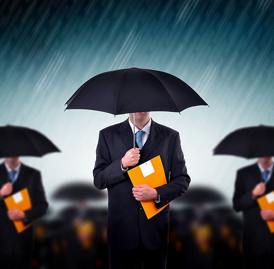Businessmen with Umbrellas