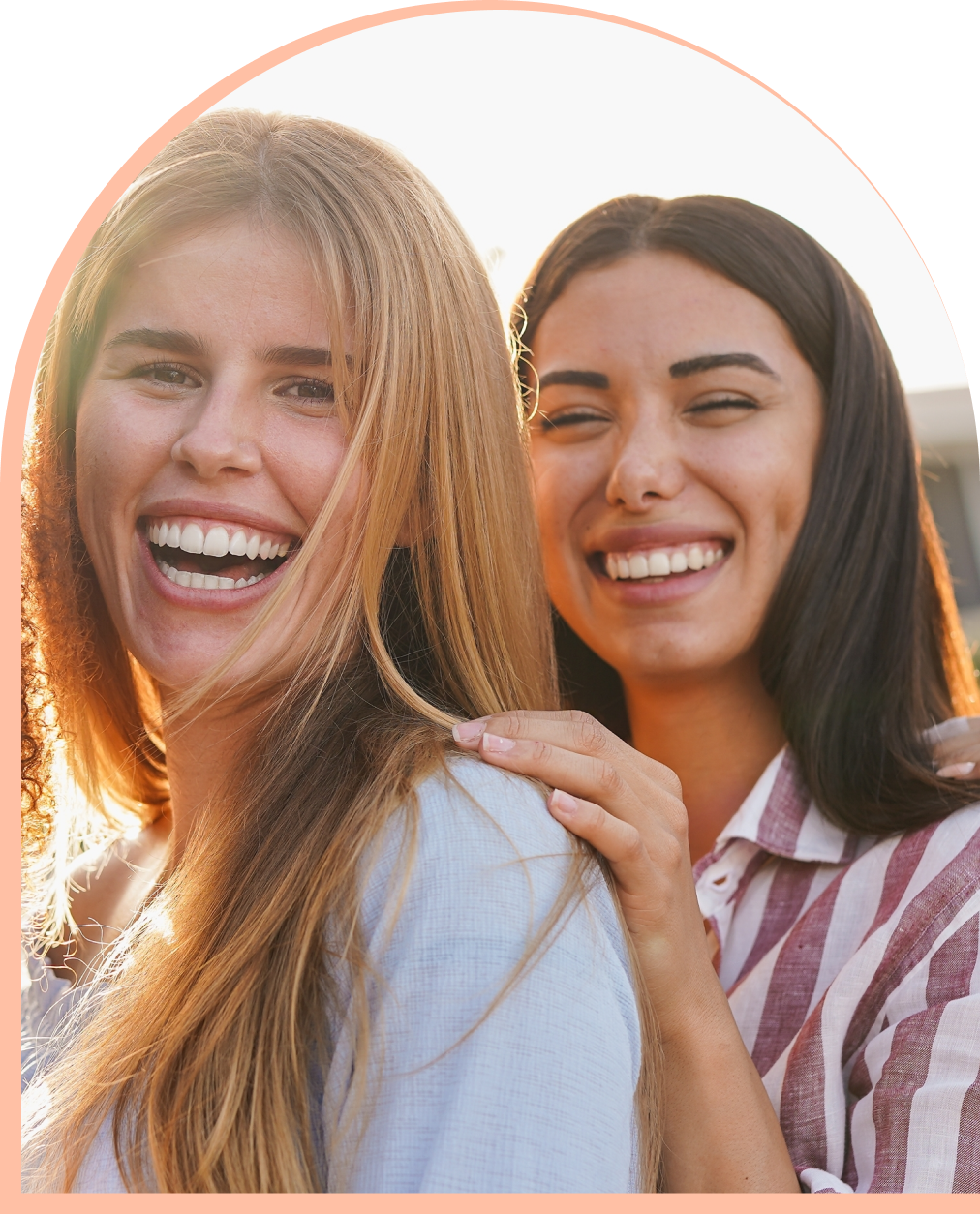 Two women smiling together (support and connection)