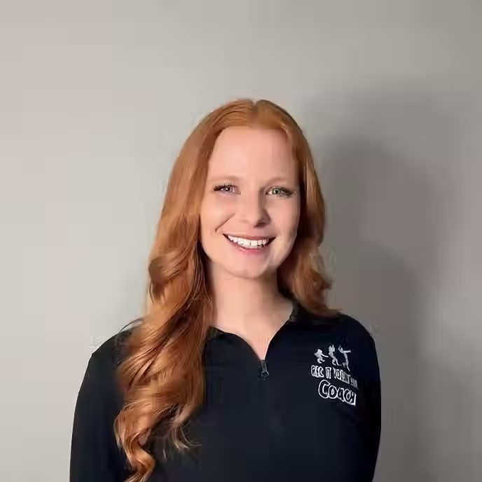 Portrait of volleyball coach Amber Rauh featured in the Rec It Volleyball coaching staff profile.