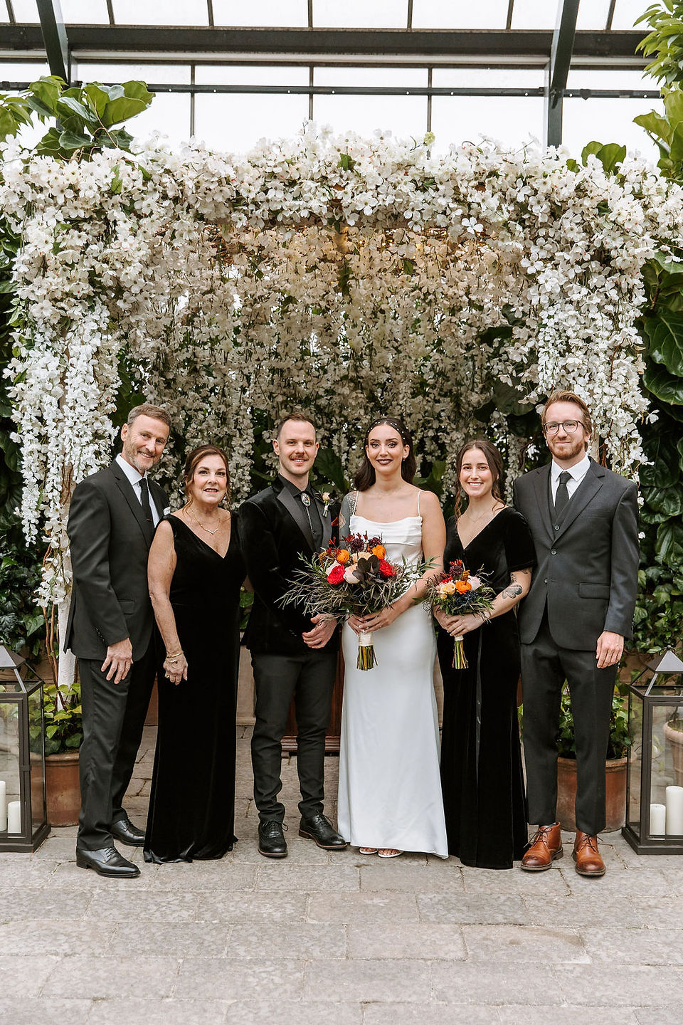 Family portraits with the bride and groom and the groom's family.