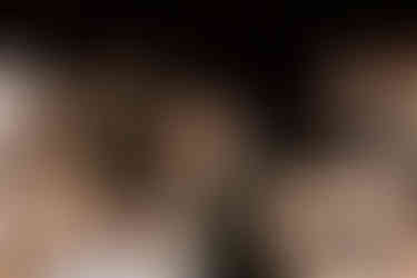 Bride and groom embracing during reception dancing.