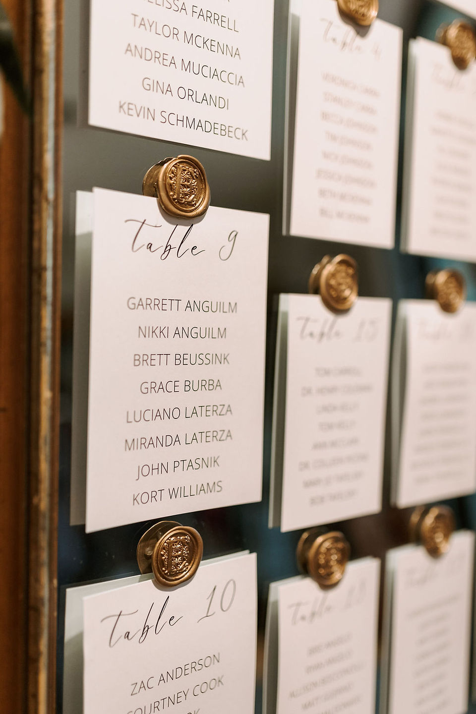 Wedding seating chart with gold wax seal.