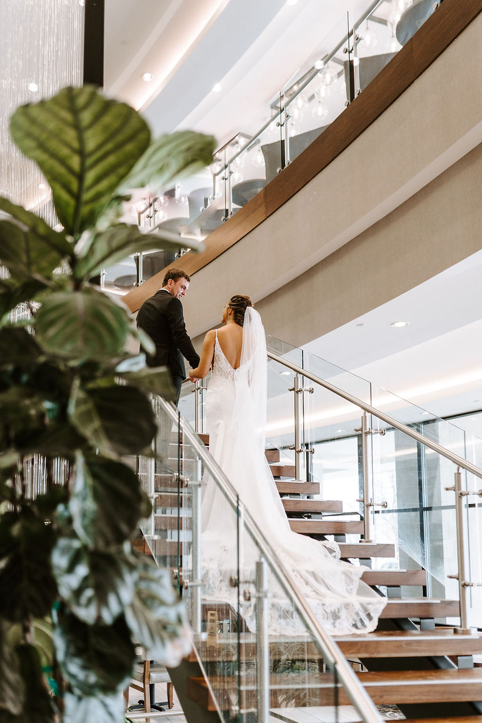 Bride and groom wedding photos at the Embassy Suites hotel in Grand Rapids, Michigan.