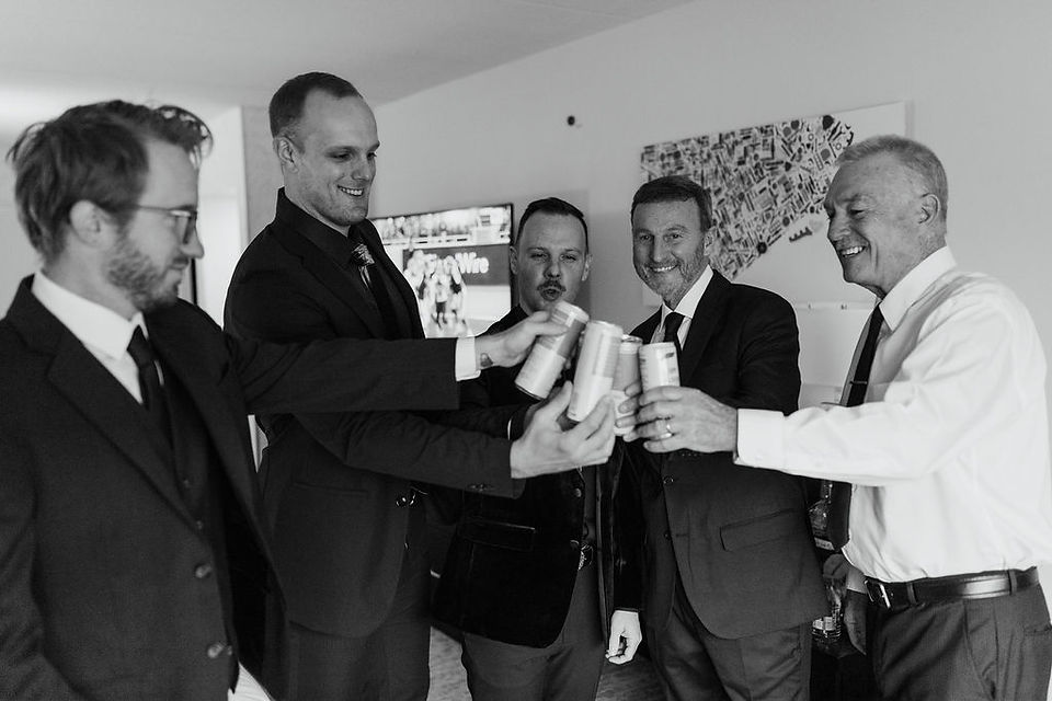 Groom sharing a toast with his groomsmen.