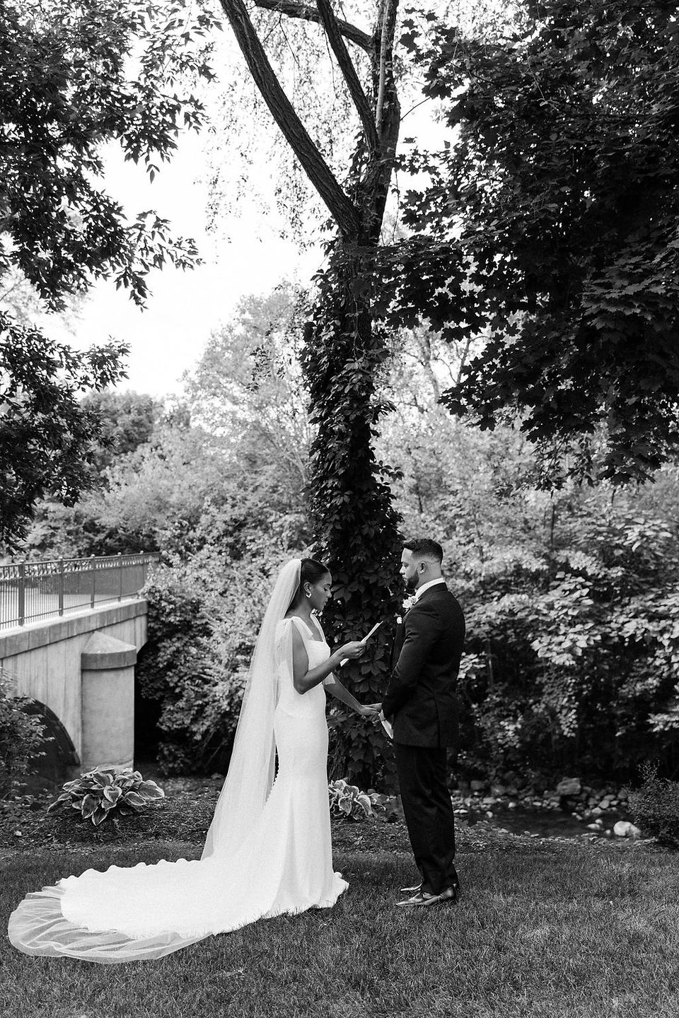 Bride and groom reading private vows.