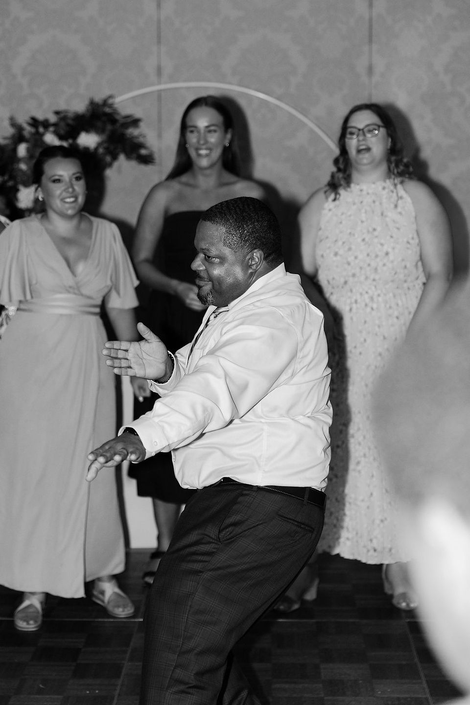 Wedding guests dancing at the reception.