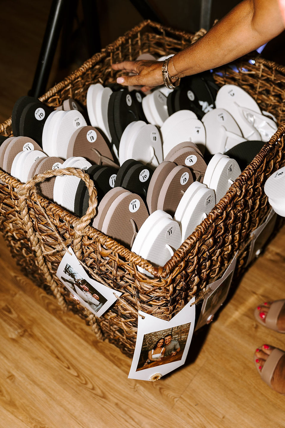 Wedding reception basket with foam flip flops for guests.