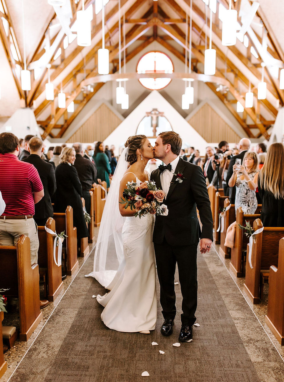 Bride and groom ceremony recessional at the St. Sebastian catholic church in Grand Rapids.