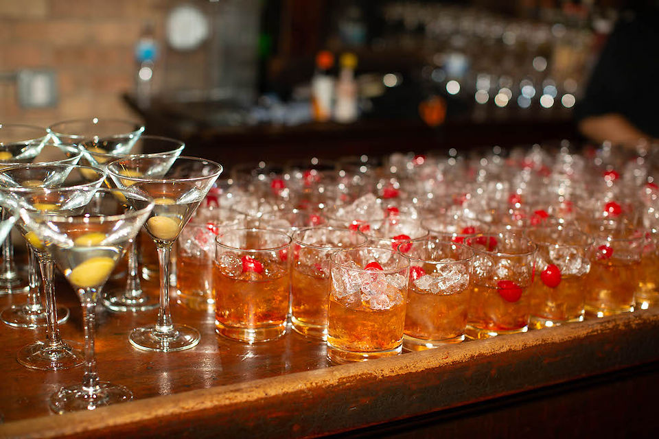 Dirty martinis and old fashions wedding cocktail hour drinks.
