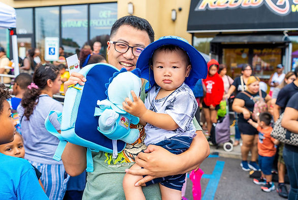 Backtoschoolgiveawaycelebration2023boyandfather.jpg