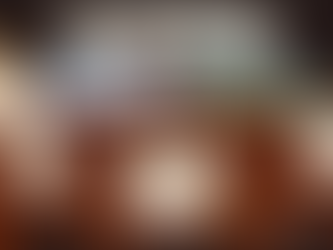 Dungeons and Dragons table set up ready to play with dice, character sheets, and miniatures. 