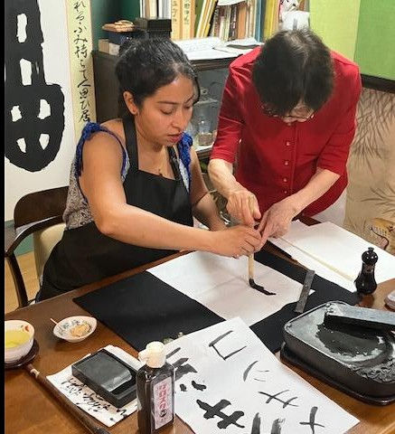 A gentle moment of a first calligraphy experience with Ginsho Sensei, guided step by step in a calm and supportive atmosphere. at GINSHO SHOIN