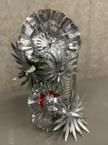 A metal lamp made of discarded metal materials. LCF student's work in response to the 'Pockets of Love' Dzaleka Arts Lab brief. 
