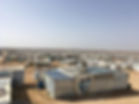 An image of Za'atari refugee camp with blue skies