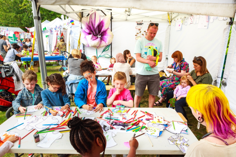 children drawing at an activity table