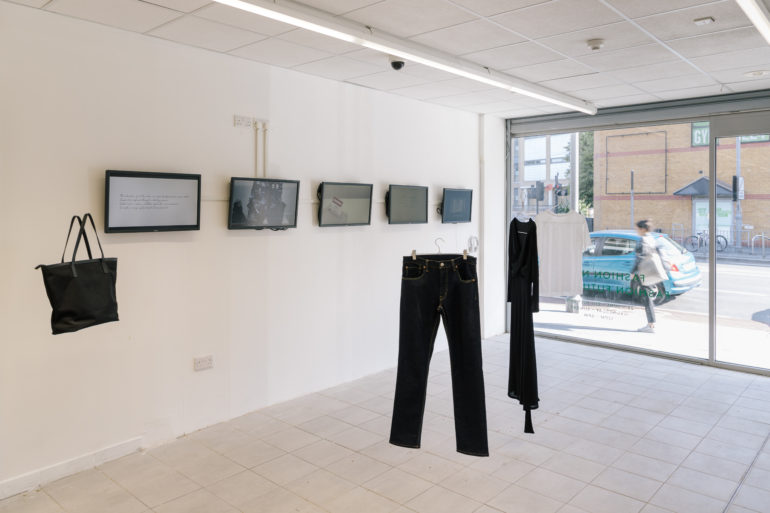 Items hanging in a gallery as part of exhibition Fashion Now Fashion Futures 2030