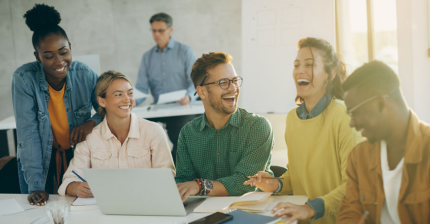 group-happy-students-having-fun-laughing-while-using-laptop-studying-classroom-their-teach