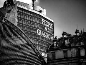 People make Glasgow sign b/w