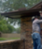 Gutter installation on a residential home exterior by Texas Contractors.