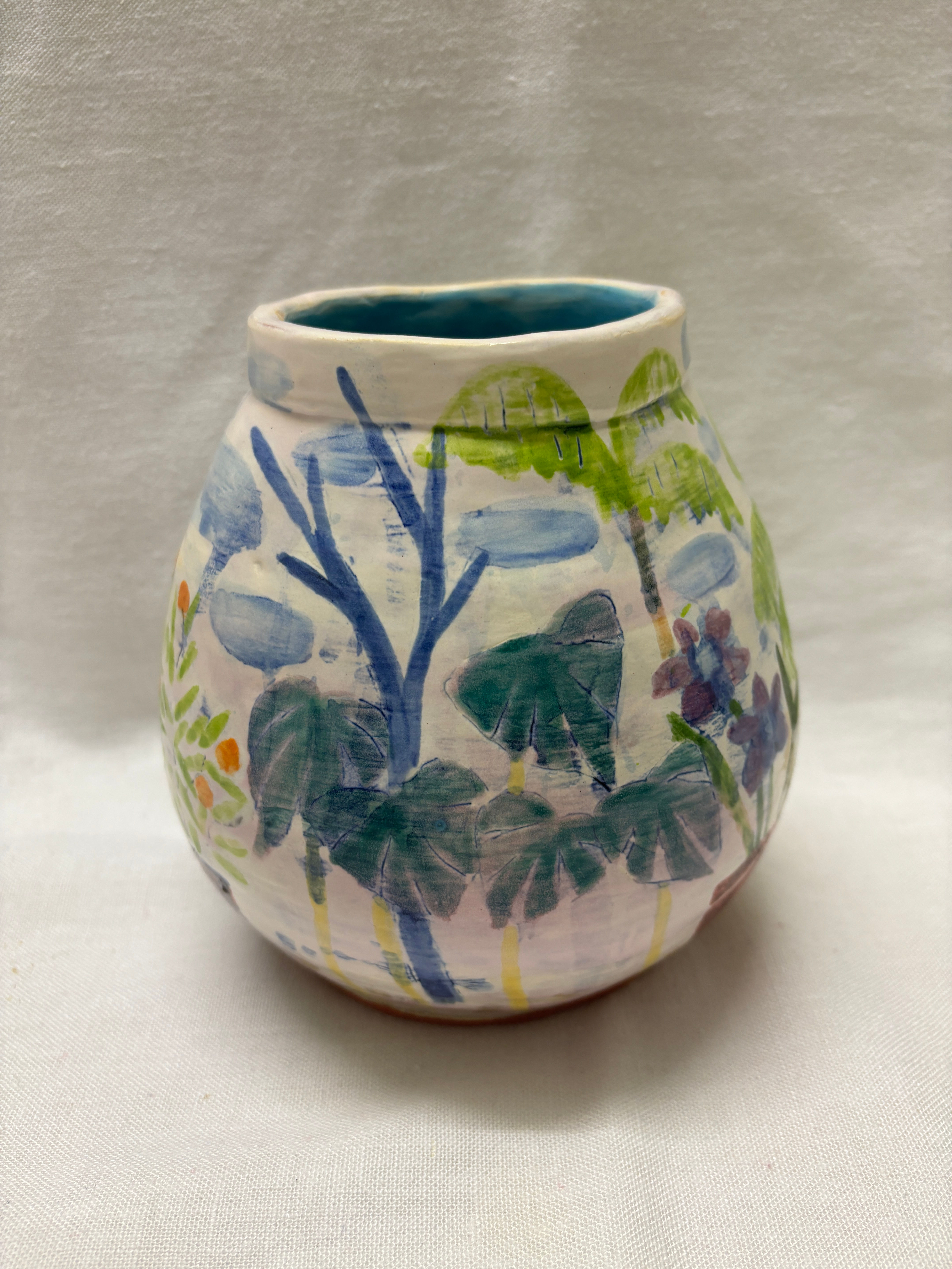 handmade terracotta ceramic with tin glaze and tropical botanical garden scene