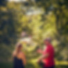 trusted tree services professional talking with client among trees and grass