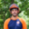 Redbird Services tree climber and bucket operator smiling wearing helmet