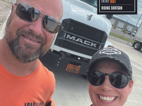 Brandy and John Seitz in front of a Load-N-Go Dumpsters truck before a dumpster delivery ride-along in the Kansas City metro.