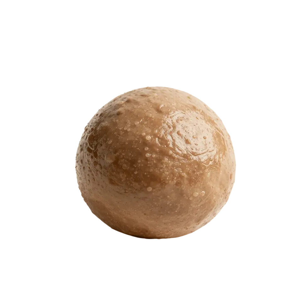 Packshot photography of a single, round truffle with a rich, textured surface. The dark background isolates the food item, highlighting its detail.