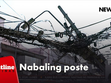 Mga poste ng telco lines, tumagilid matapos sumabit sa truck ang mga kawad nito