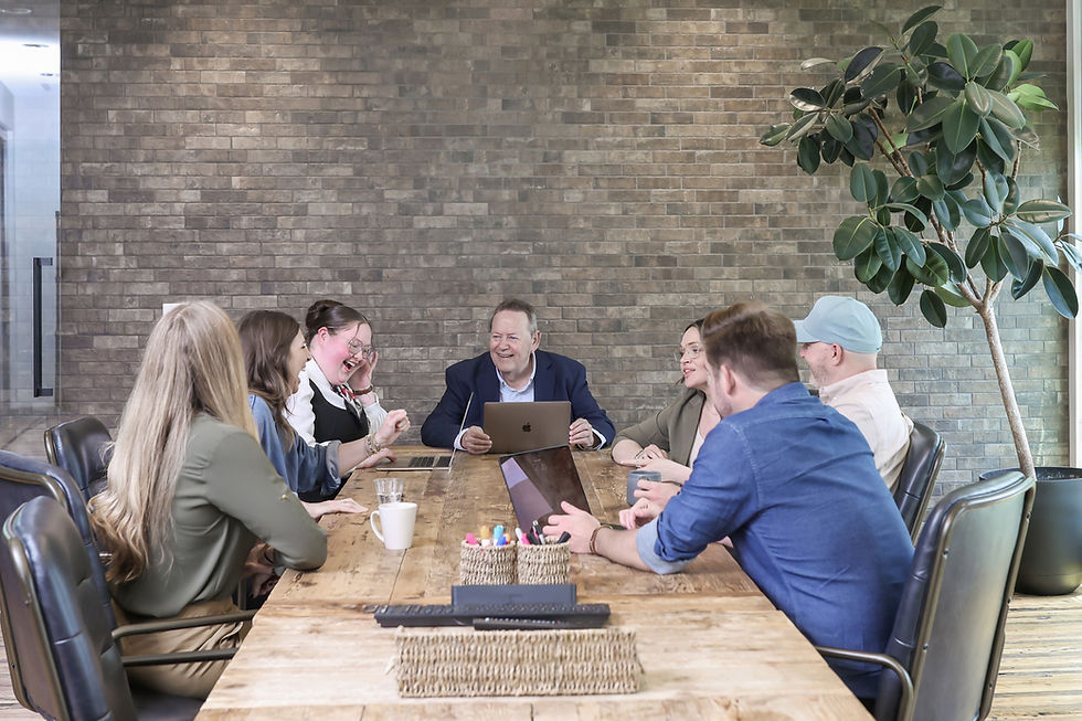 Thrive Creative Group team collaborating with long-term clients during a creative meeting