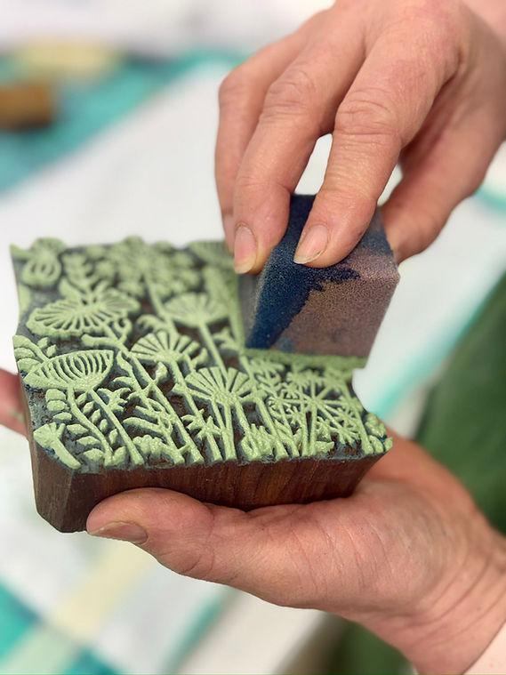Applying paint to block