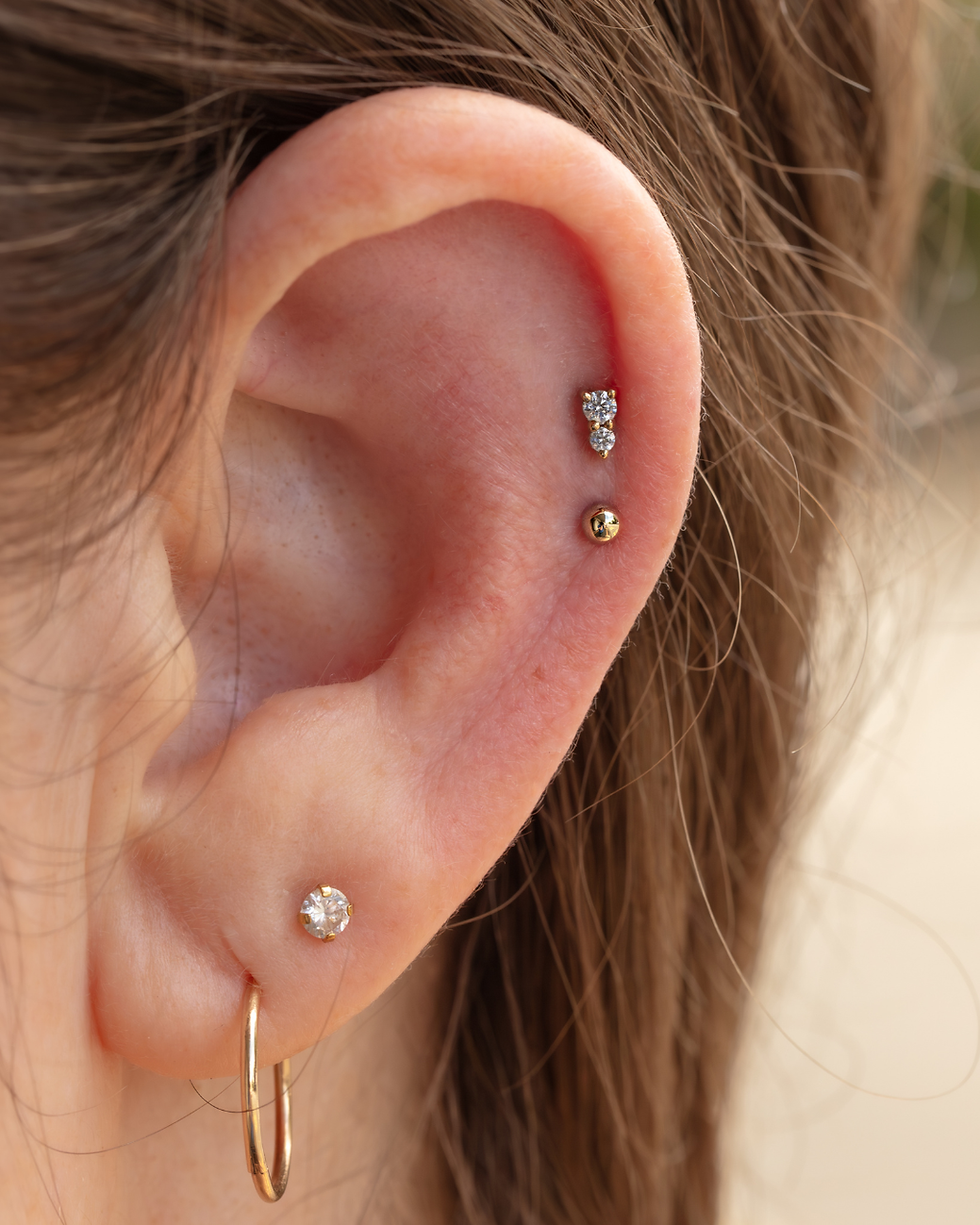 curated ear pierced safely by platinum point piercing in auckland with bvla solid gold