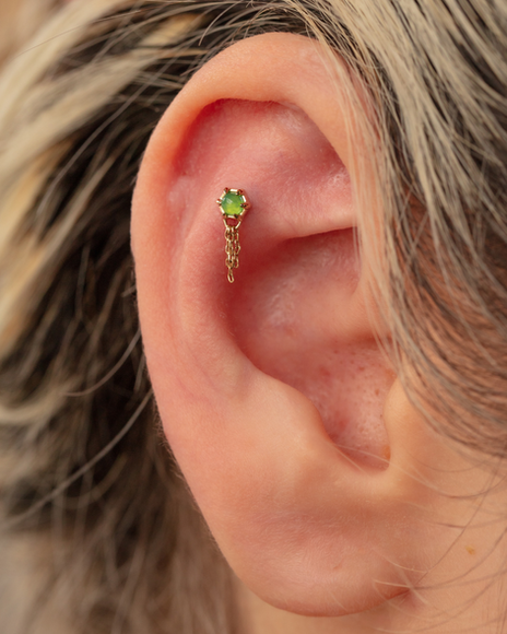 flat piercing done with 14k solid gold jewellery in Auckland