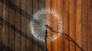 pressure washing a dirty deck half stained half clean.jpg