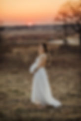 prenant woman at sunset