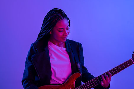 medium-shot-woman-holding-guitar.jpg