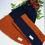 Thumbnail: Set of black and dark orange handcrafted beanie and scarf
