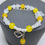 Thumbnail: Women Yellow Beads Bracelet on a stand View