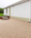 Premium resin driveway in Northern Ireland by a white house.