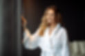 Woman smiling in white robe