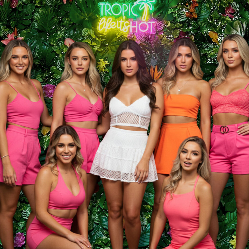 A bachelorette party in front of a tropical wall backdrop with a sign that reads Tropic Like It's Hot