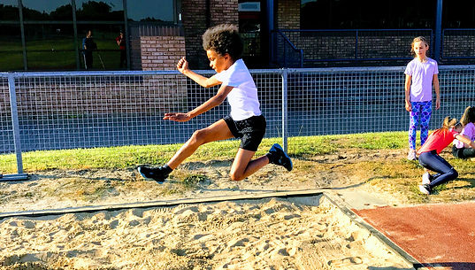 Young athlete practicing long jump