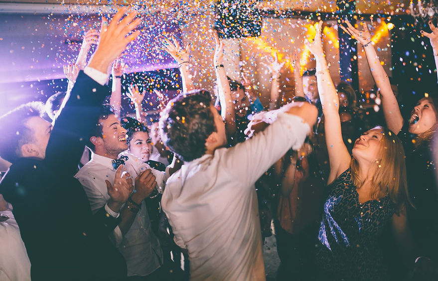 group-of-hipsters-throwing-confetti-at-a-party-in-royalty-free-image-469322890-1544723219