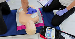 CPR training medical procedure workshop Demonstrating chest compressions and use of AED au