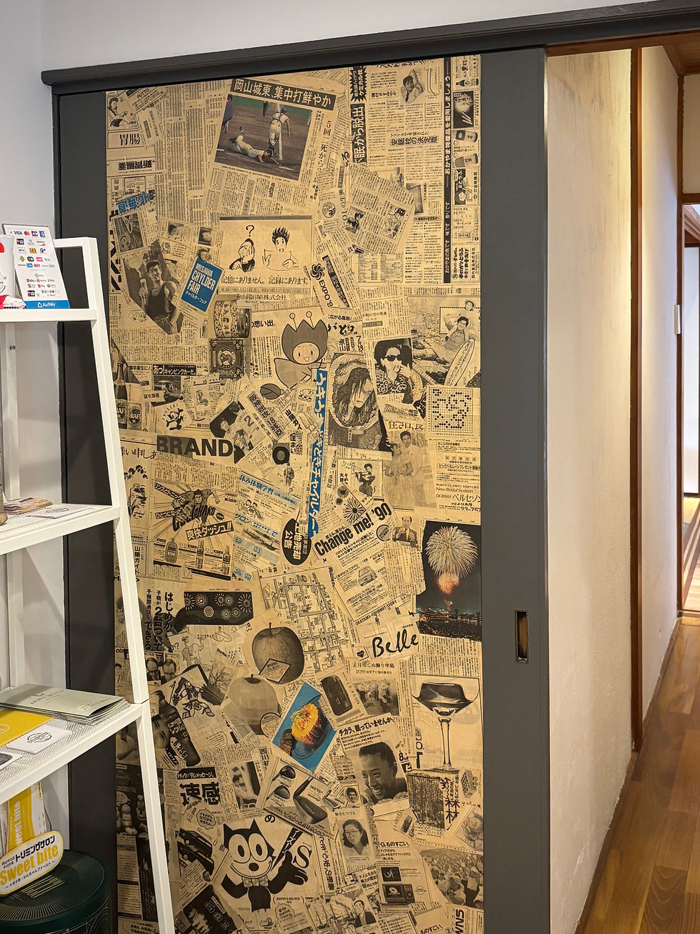 vintage Japanese and Italian newspaper door decoration at Lemon Tree Okayama