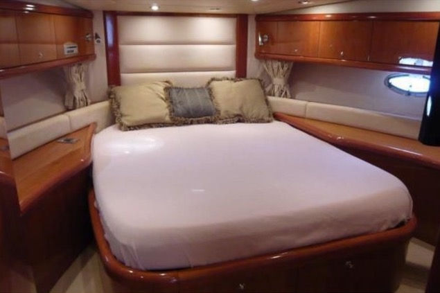 Luxurious master suite bedroom on the Hibiki Sunseeker 60 overnight yacht rental.