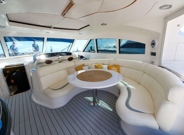 Elegant interior saloon and dining area inside the Just to Splash Neptuno 60 yacht charter.